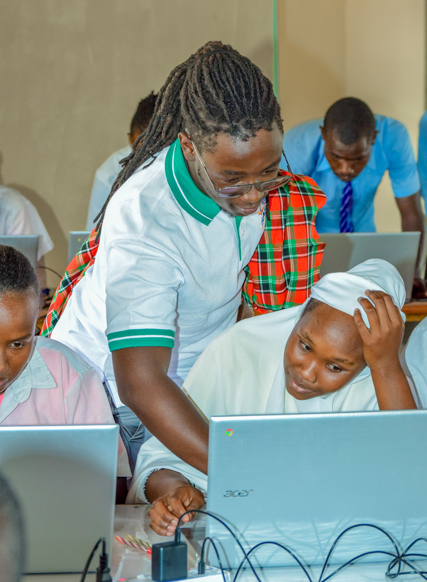 Mentor with two children using a tablet